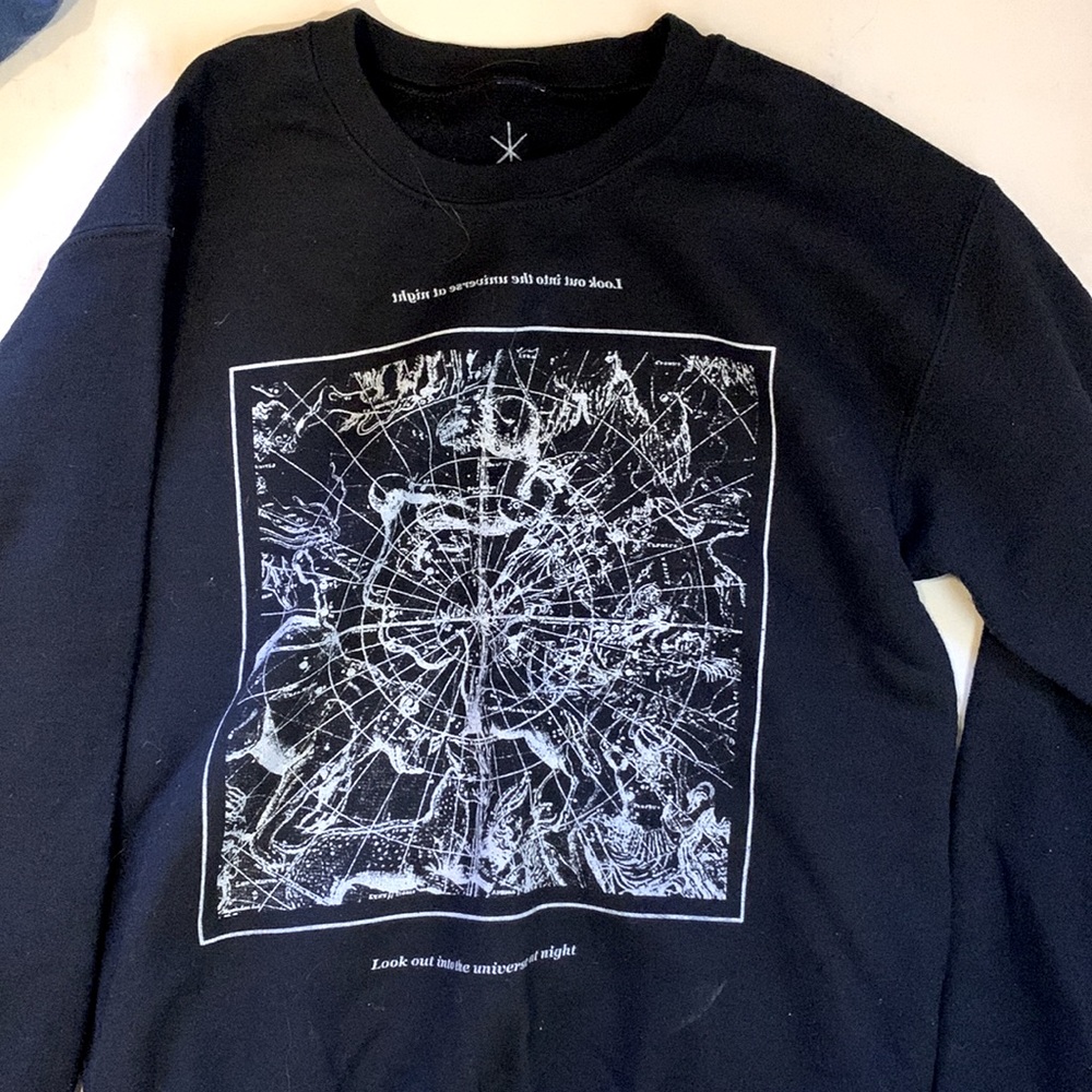 Crewneck, thick. “Look out into the universe at night” text.